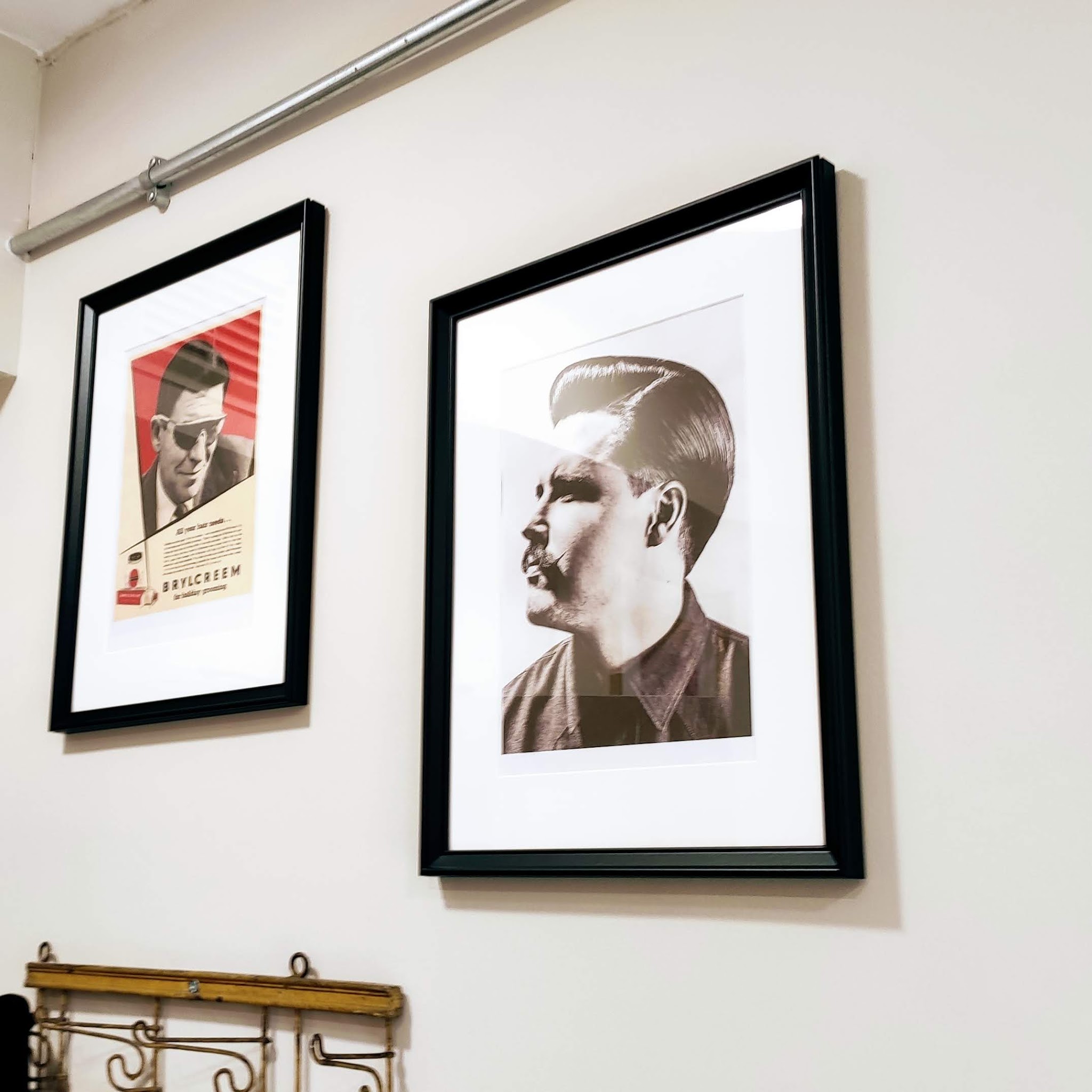 Two framed vintage barber posters
